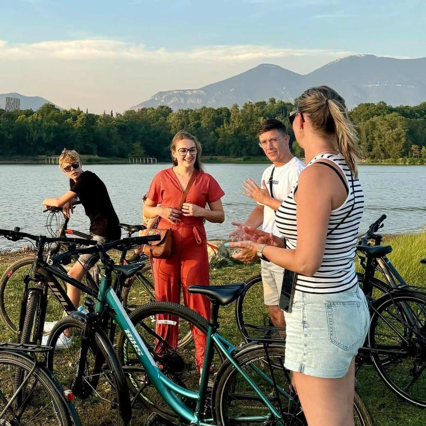 Cyclists on a guided ride through central Tirana on a sunny afternoon