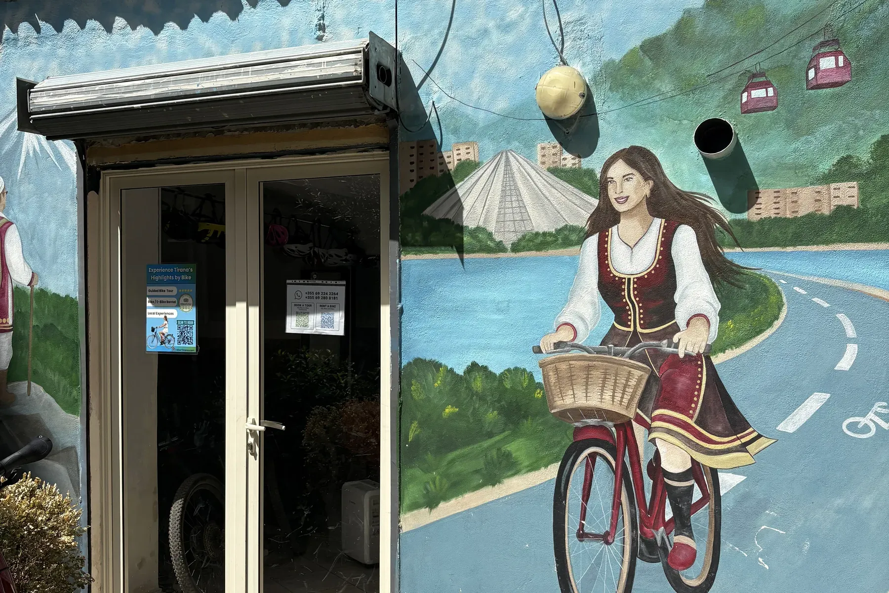 BikeTirana entrance and cycling mural at the New Bazaar in Tirana